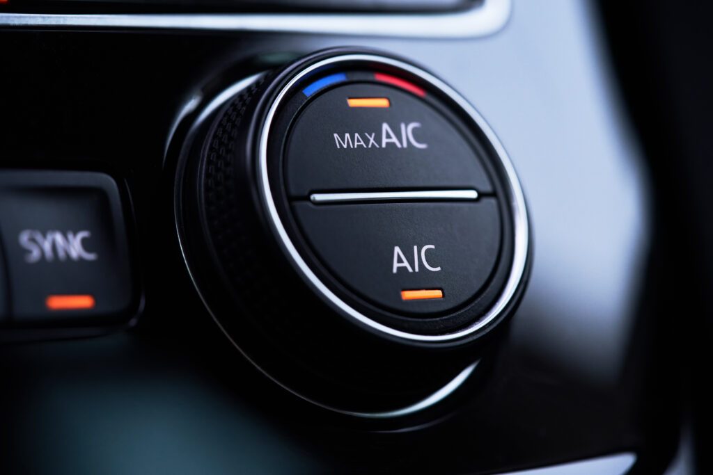 Car air conditioning controls switched on inside a vehicle cabin